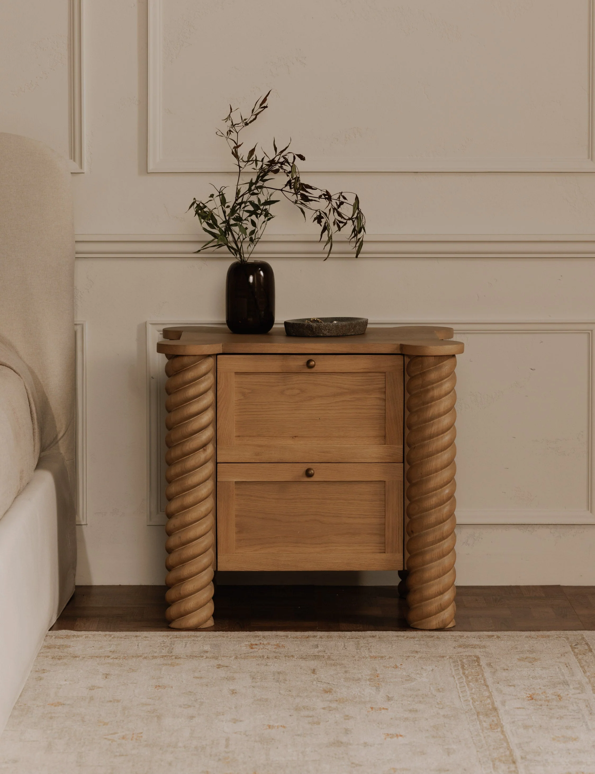 2-Drawer Nightstand - The nightstand embodies a contemporary reinterpretation of classical aesthetics, distinguished by its intricate turned and