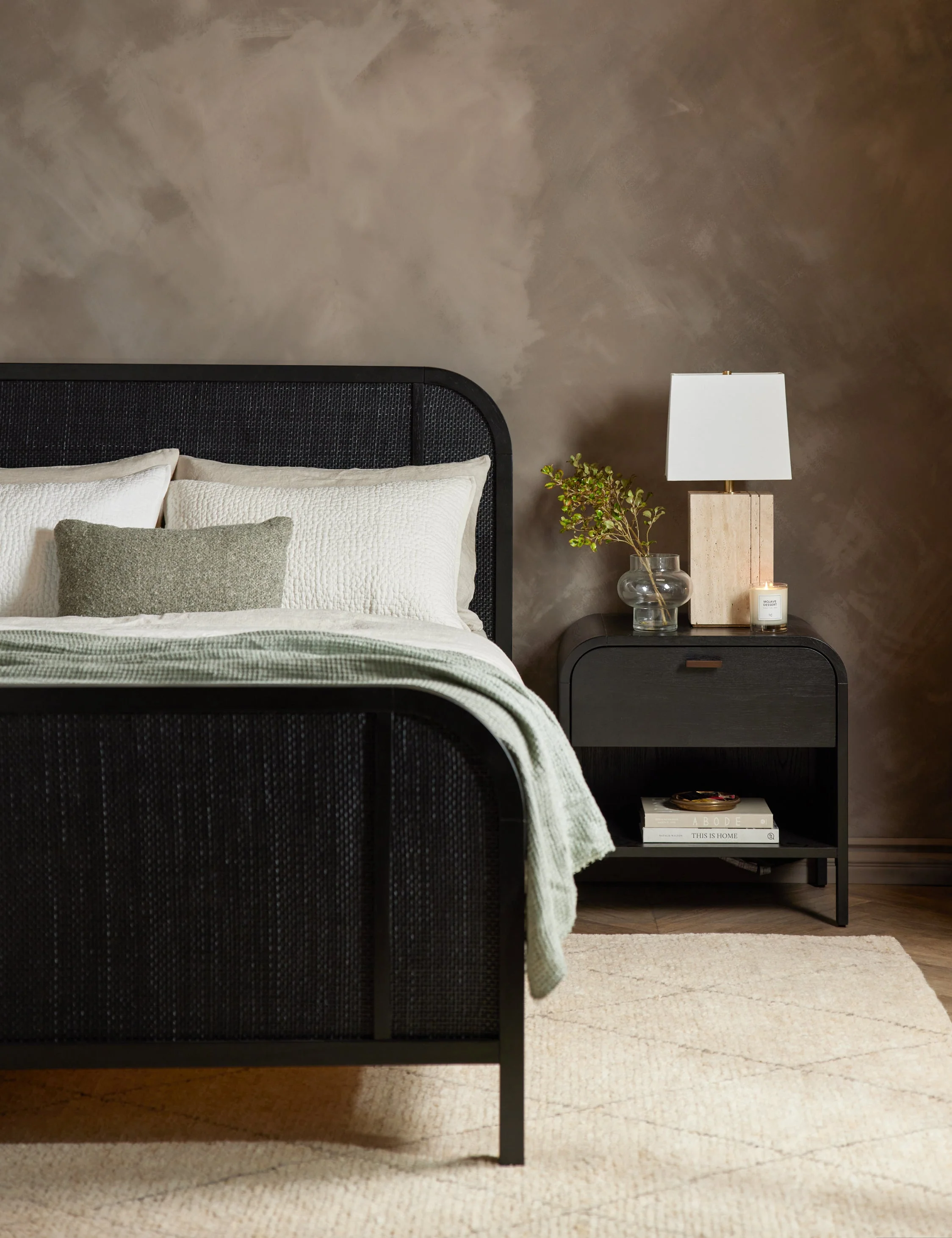 Nightstand The finish of this nightstand warmly compliments the arched corners of its undersd design. It is fitted with a sk iron pull, a roomy