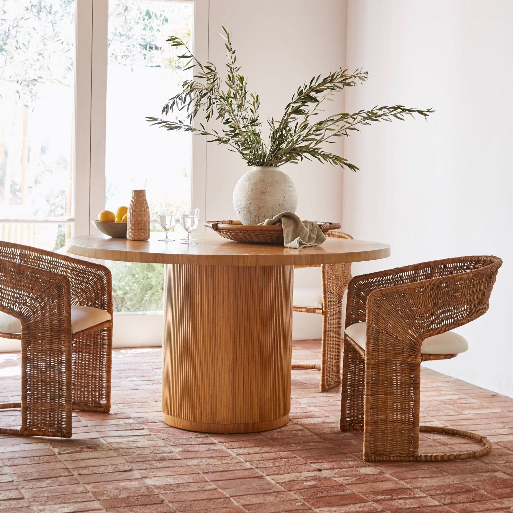 Round Dining Table - sophisticated and rich in character, this round dining table balances sleek style with organic spirit