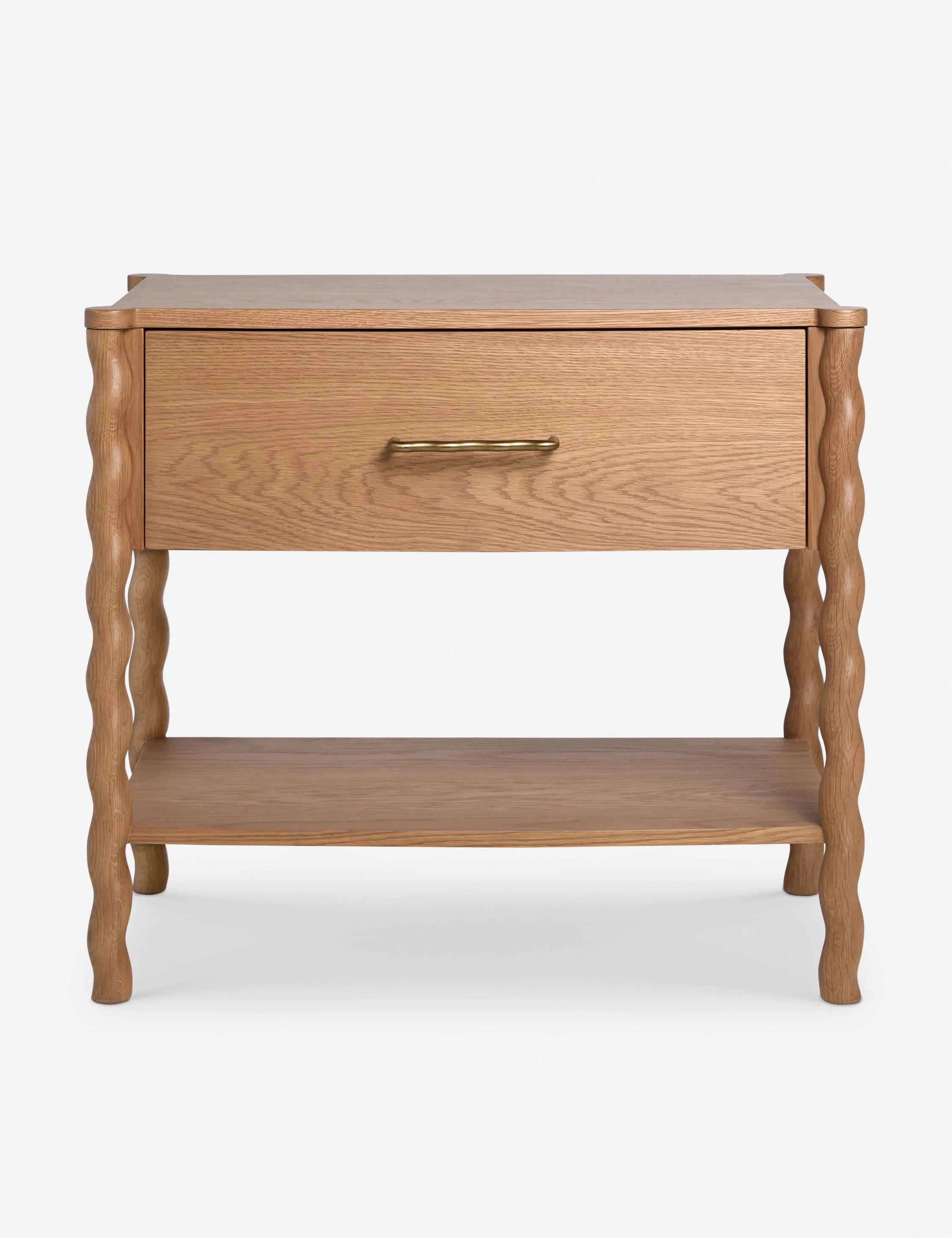 Nightstand Our nightstand offers natural grain texture with a twist. The clean wood silhouette is offset by turned legs and a wavy brass-finished