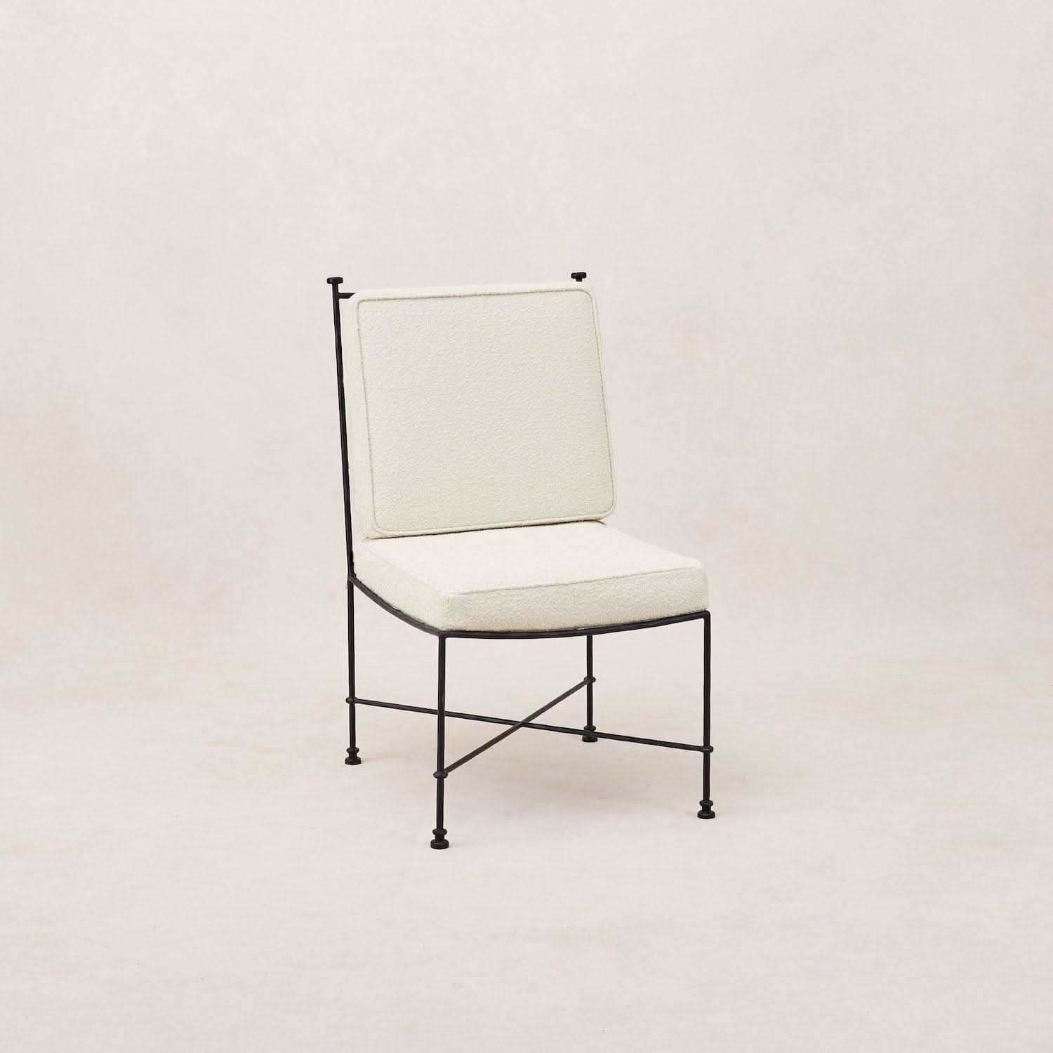 Outdoor Armless Dining Chair - Boucle - with a slender iron frame and upholstered in plush outdoor boucle, it’s designed to withstand the elements...