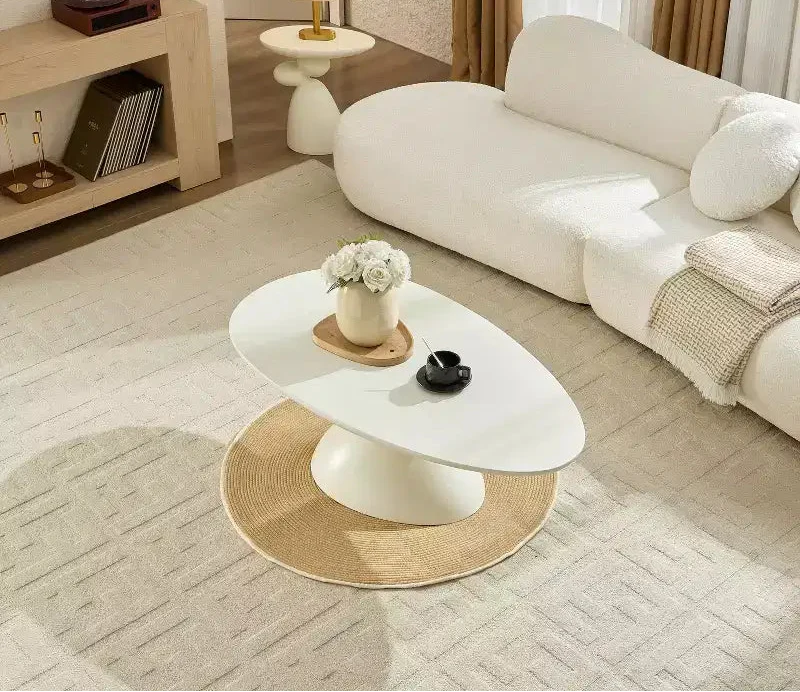 47 Inch Oval Fiberglass Coffee Table with Sculptural Stacked Base, White