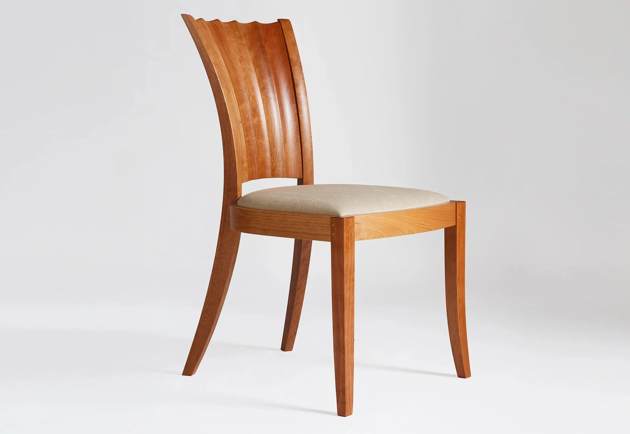 Side Chair - The hourglass lines of the – seen in the hand-carved convex and concave curves of its distinctive back