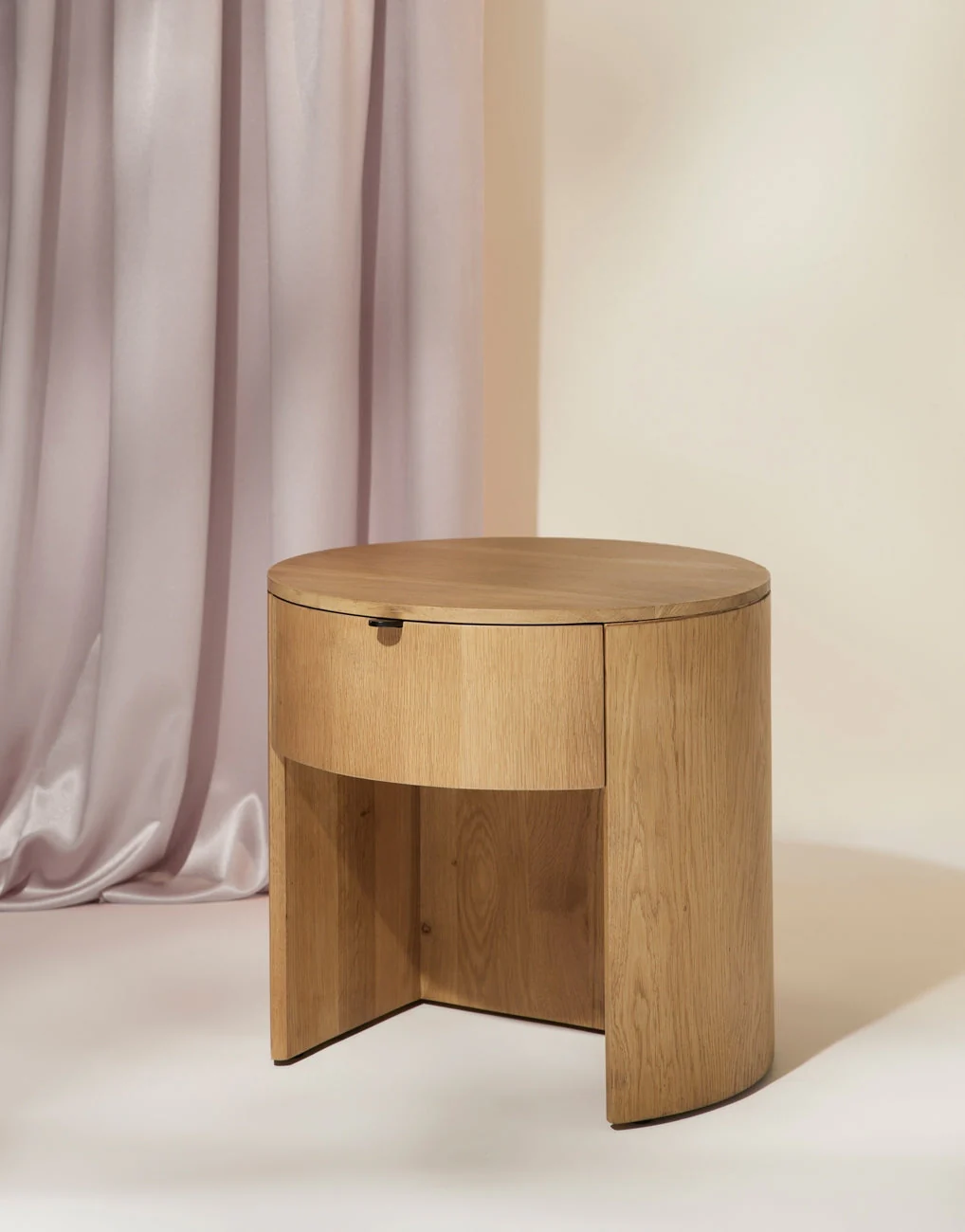 Nightstand Crafted from solid oak, the Nightstand is a beautifully versatile piece for your bedroom. Its curved silhouette creates visual interest