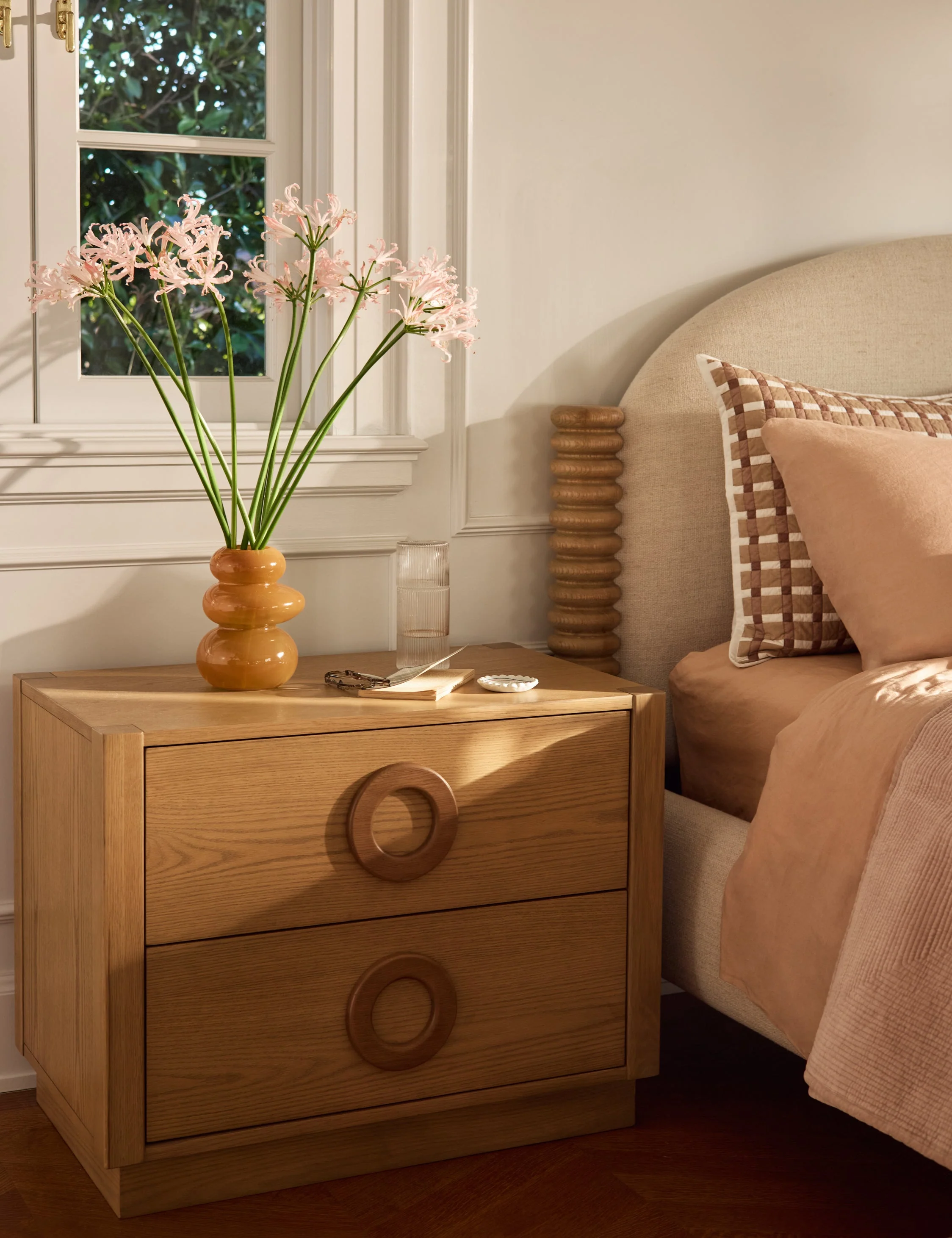 Nightstand - Our nightstand brings a warm, modern shape to your bedside