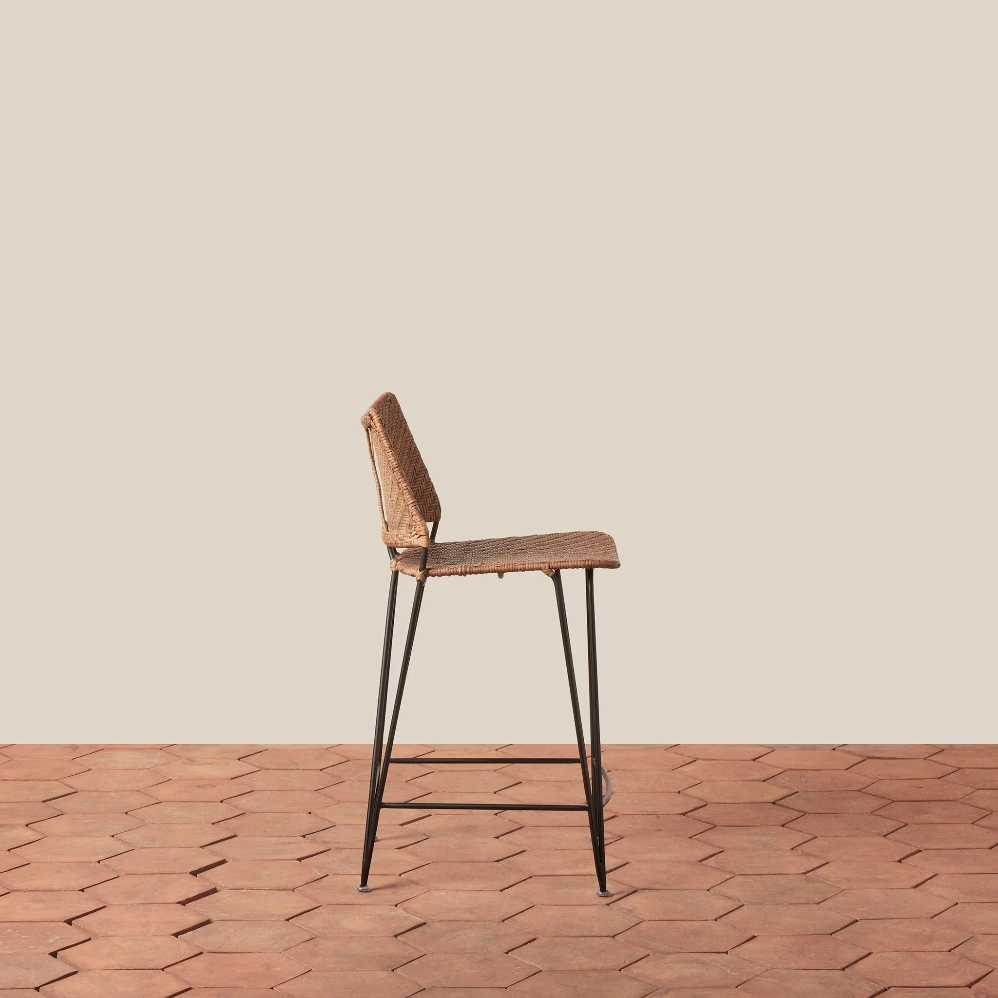 Counter Stool - With its graceful curved back and slender hairpin legs, the stool brings timeless architectural form to kitchen and counter spaces