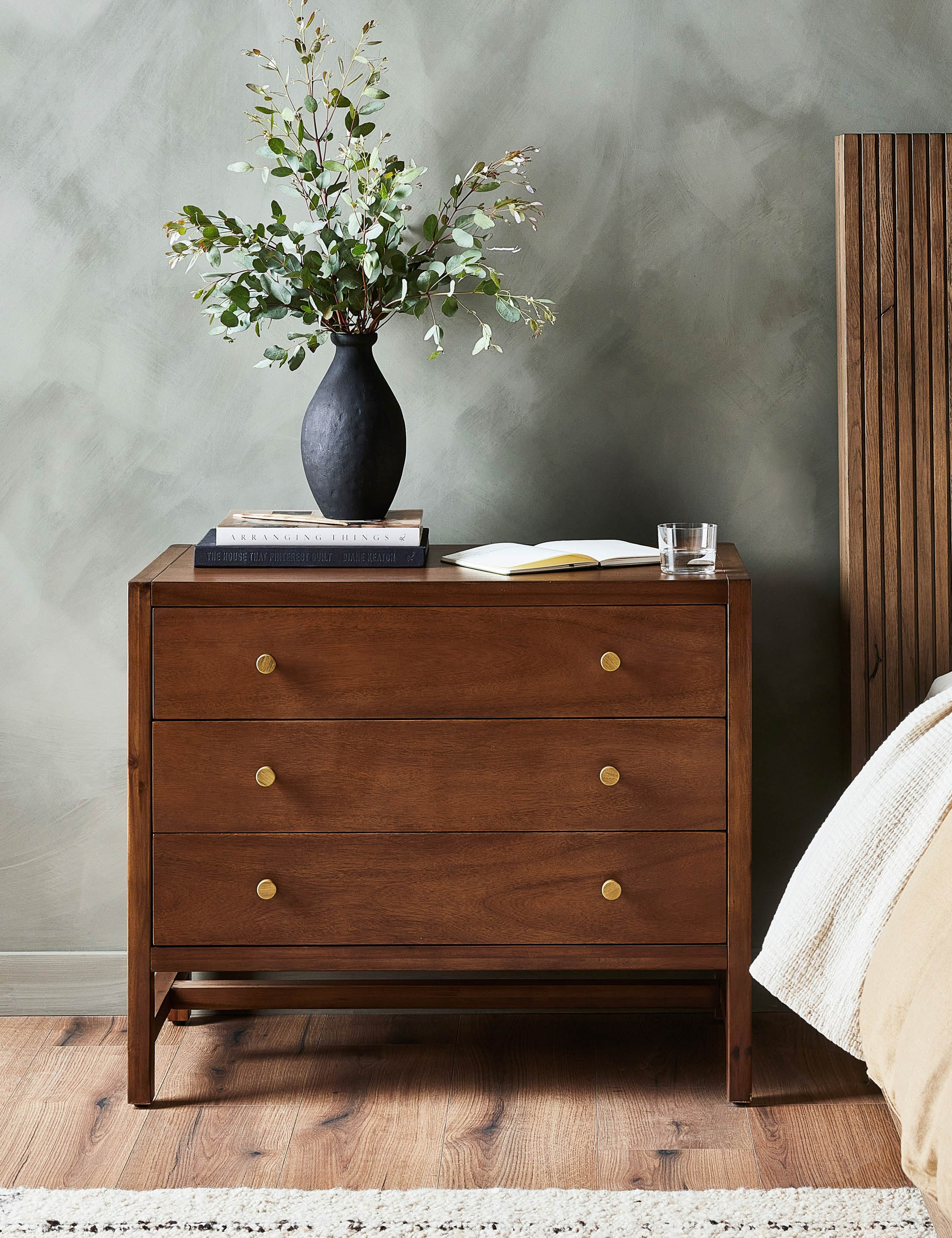 Nightstand The nightstand is set for warmth and elegance. The Parsons-style silhouette offers clean appeal whether your bedroom leans modern
