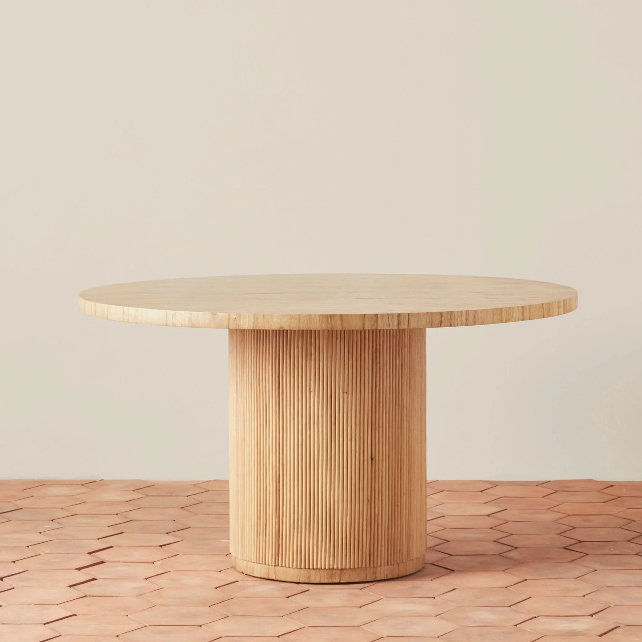 Round Dining Table - sophisticated and rich in character, this round dining table balances sleek style with organic spirit