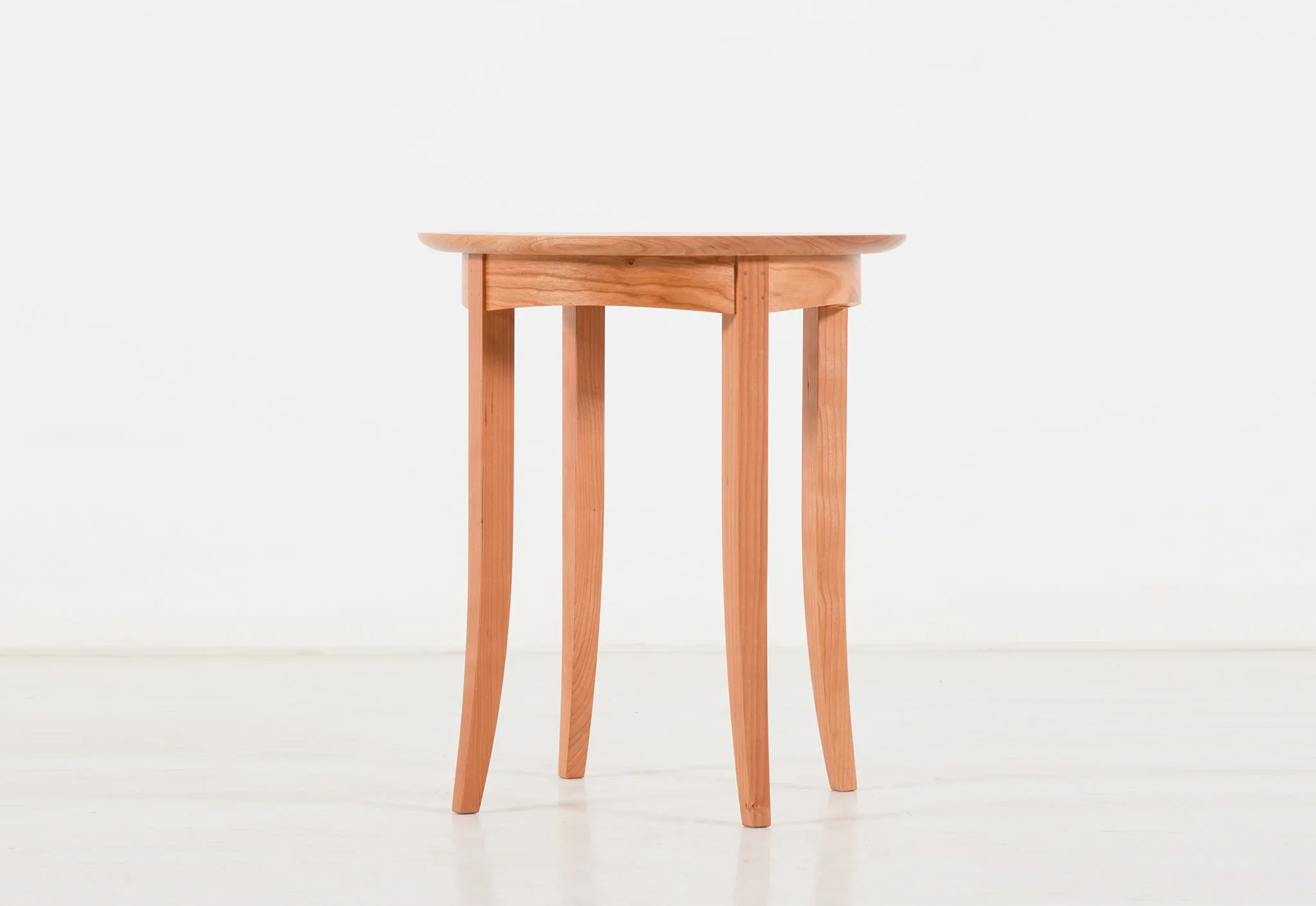 Wing End Table - Designed with the same fervent precision, the table can sit with elegance beside the Wing Chair