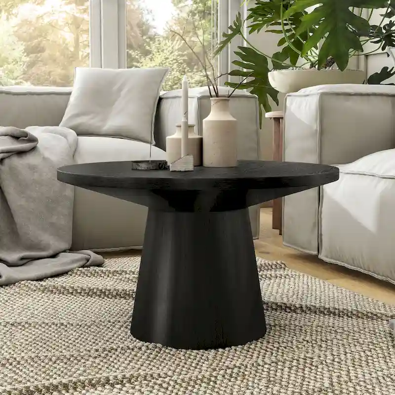 Modern round coffee table with solid wood base