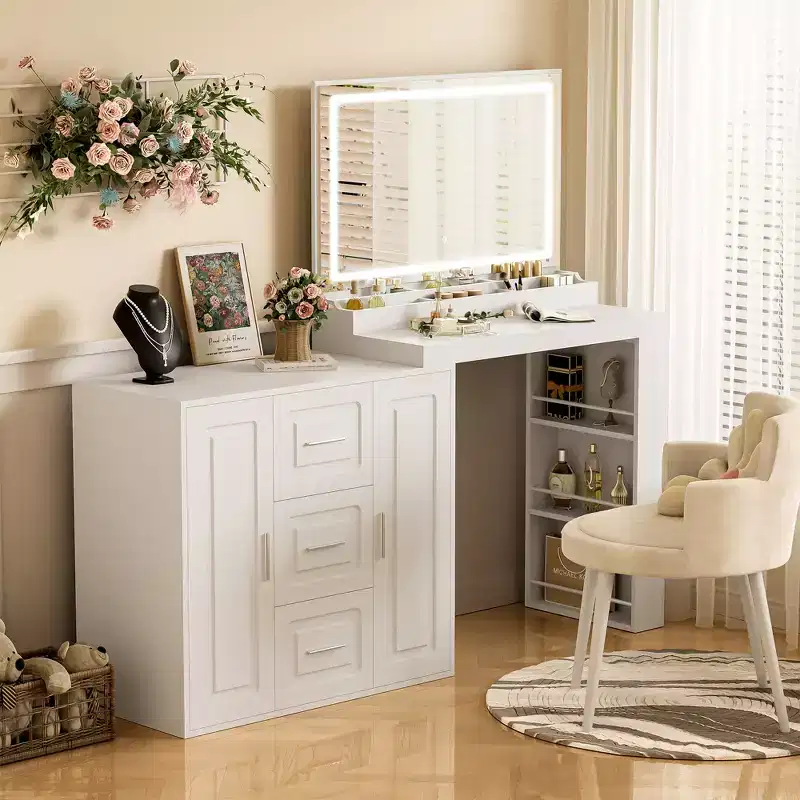 The dressing table includes a mirror with a light, 3 drawers, 2 cabinets, and storage shelves. A stool is not included White