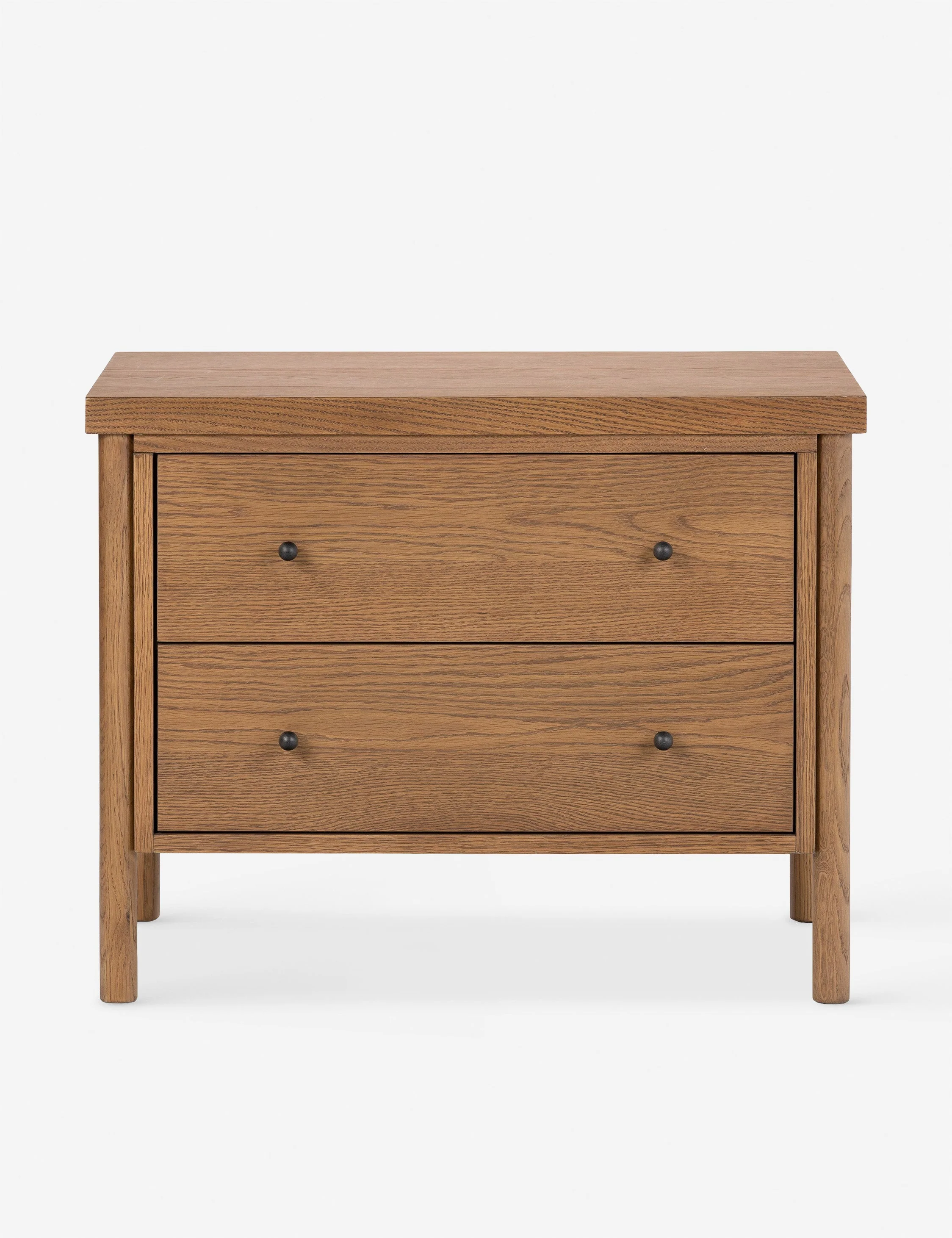 Nightstand The nightstand brings transitional appeal to oak. Rounded legs hold a clean-lined frame in a warm finish that showcases the natural
