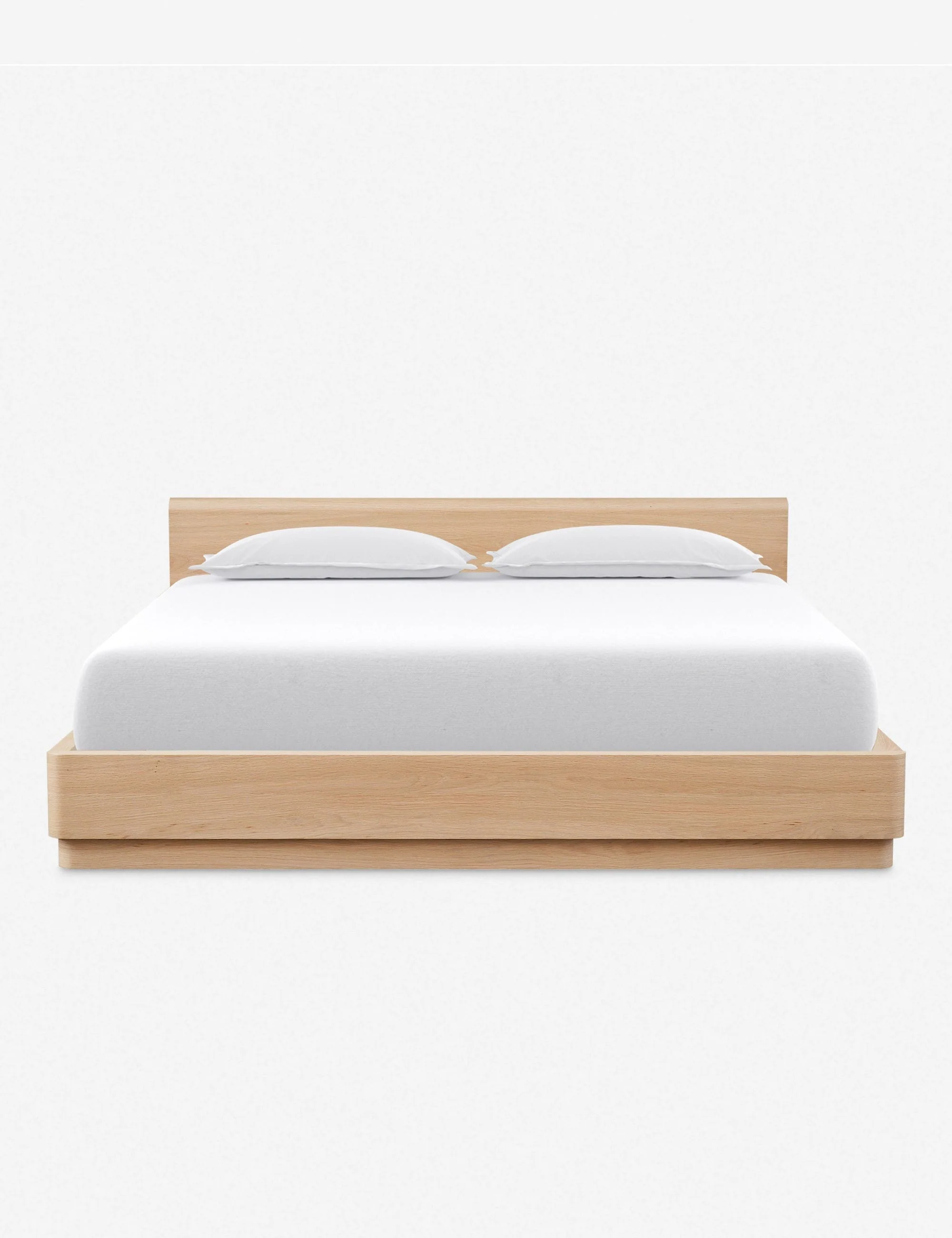 Bed A beautiful platform bed from the Collection featuring solid oak construction with softly molded corners and a low-slung design. Clean, gentle