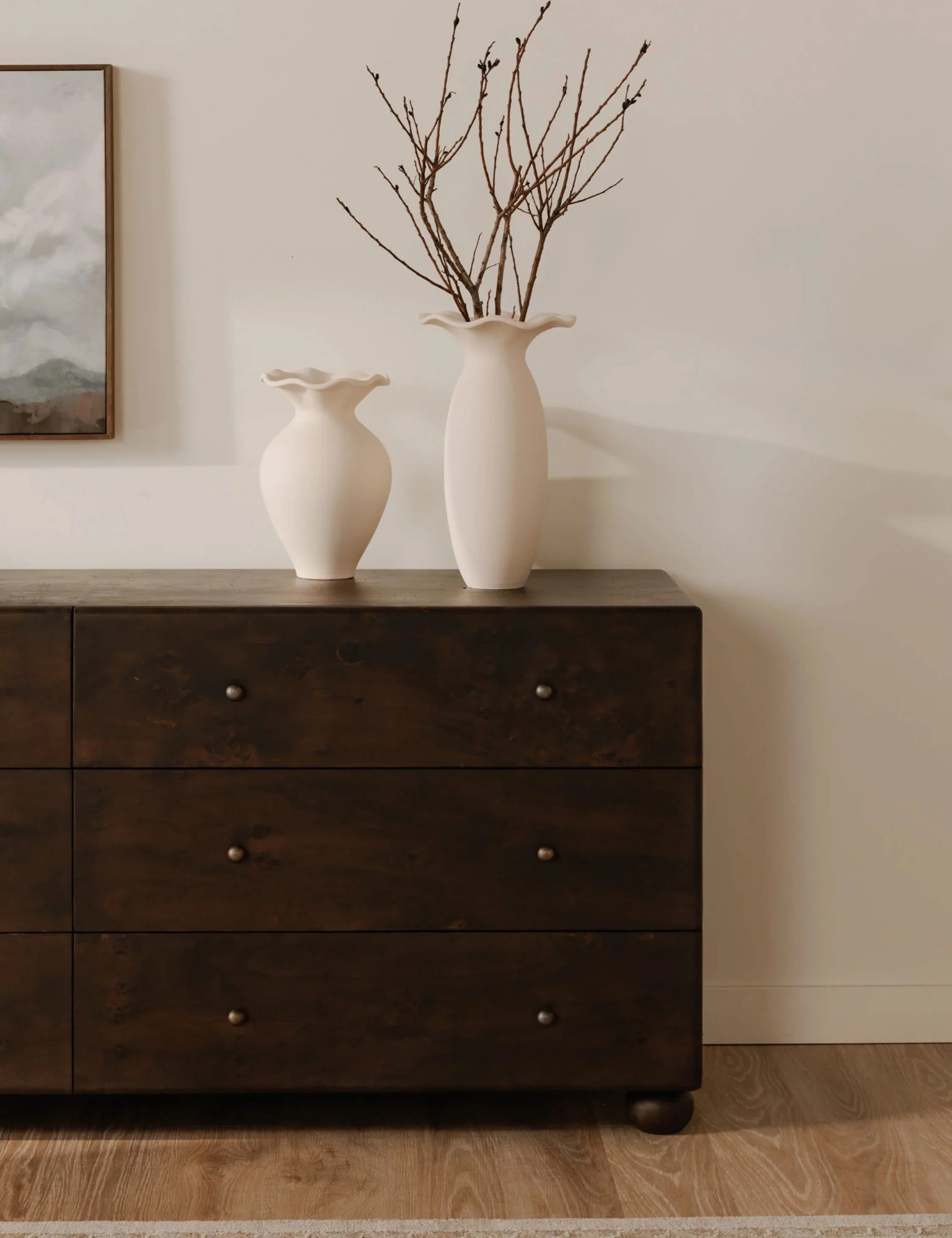 Dresser Bring a timeless finish to your bedroom edit. The dresser sits on bun feet with a solid bearing, clad in burl and brass for that undersd