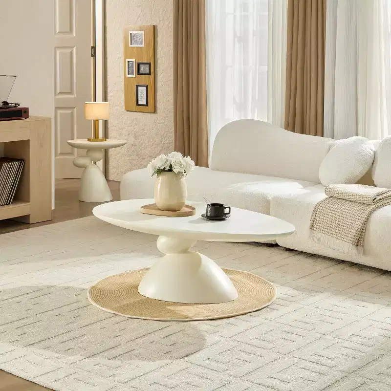 47 Inch Oval Fiberglass Coffee Table with Sculptural Stacked Base, White