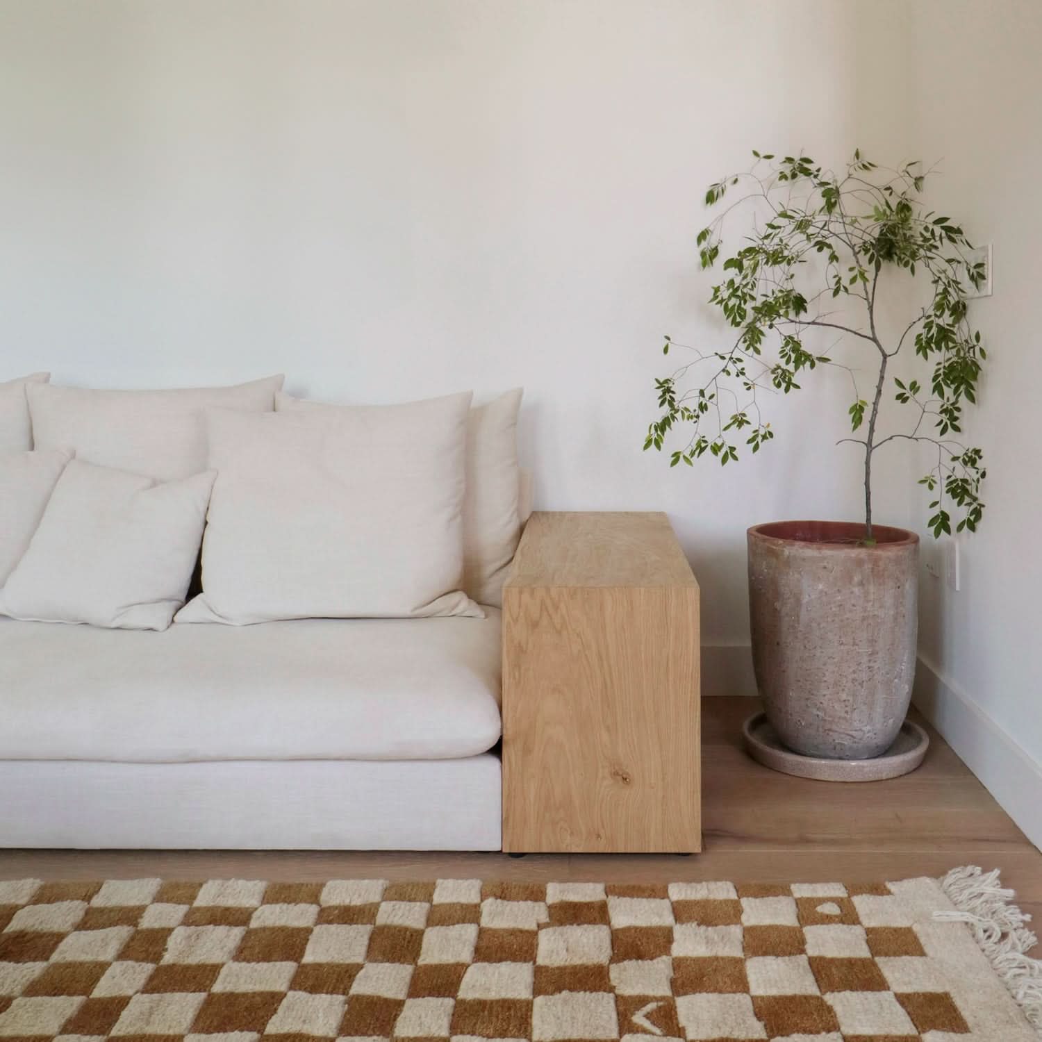 Sofa - The wood sides, representative of the mountain ranges that flank the valley, offer themselves as side tables for those looking for...