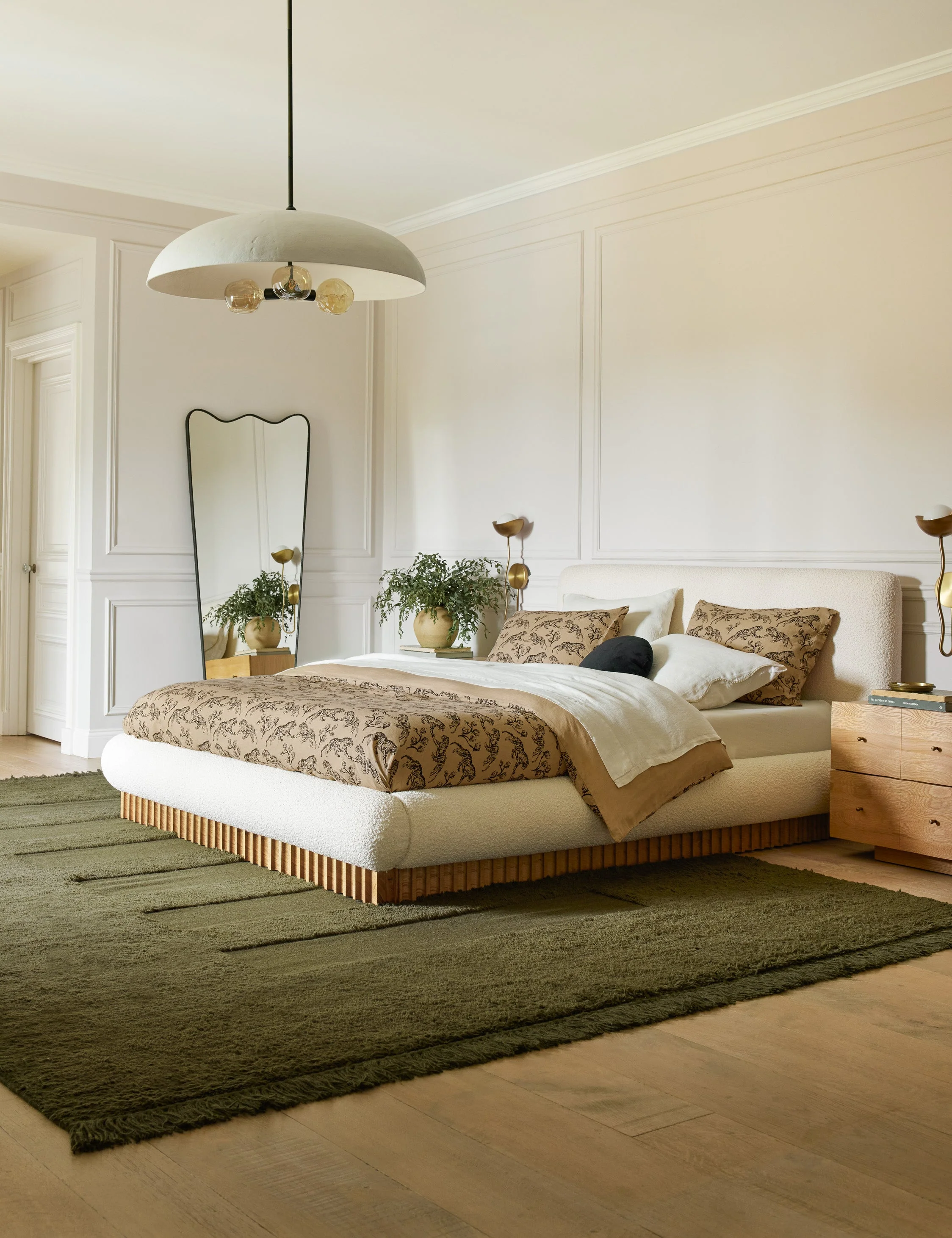 Bed Bouclé, Plinth Base This plush, overstuffed bed frame offers a cozy night's sp with its signature profile. Set on a d wooden plinth base,
