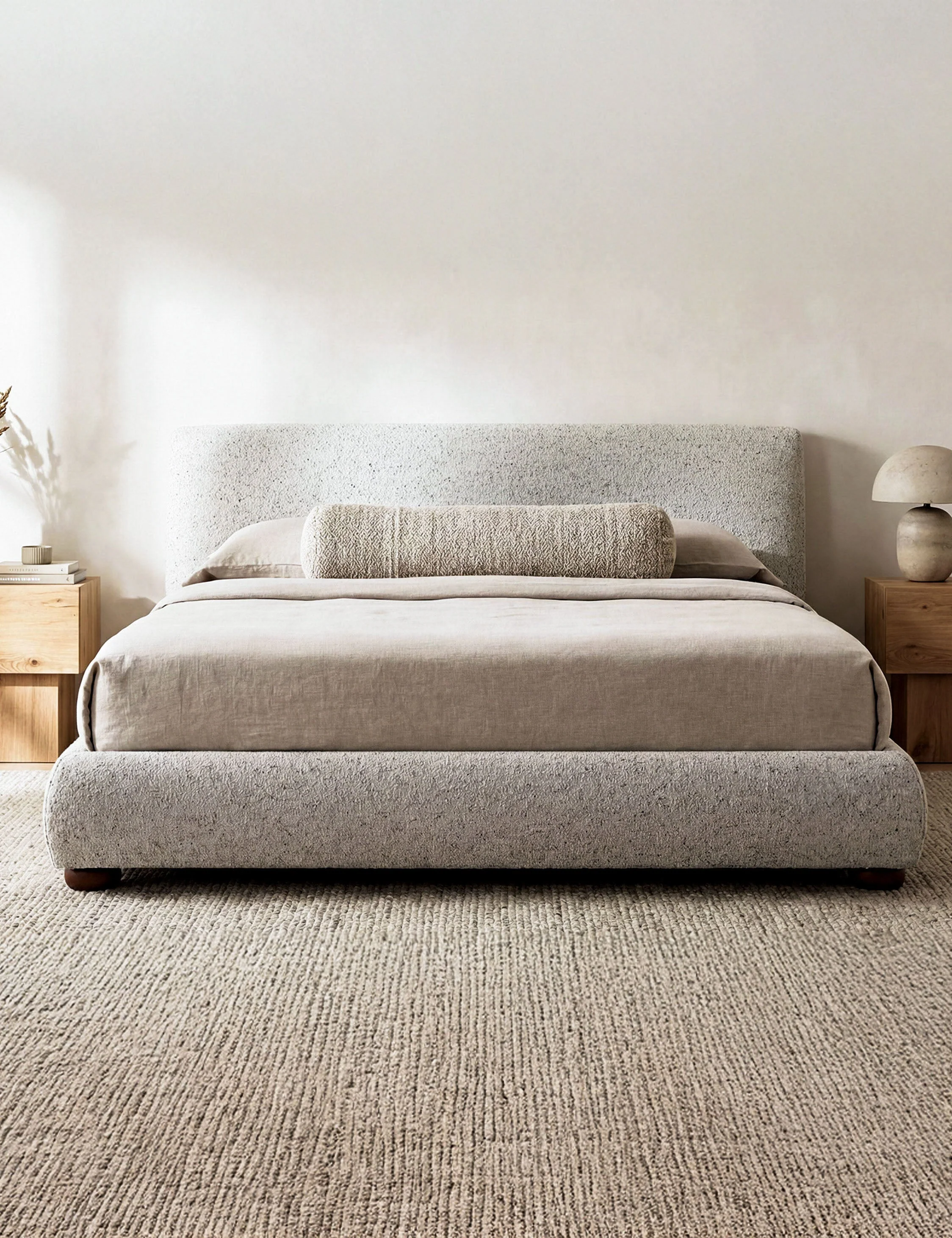 Bed - The bed offers soft impact with a softly rounded headboard and playful bun-style legs