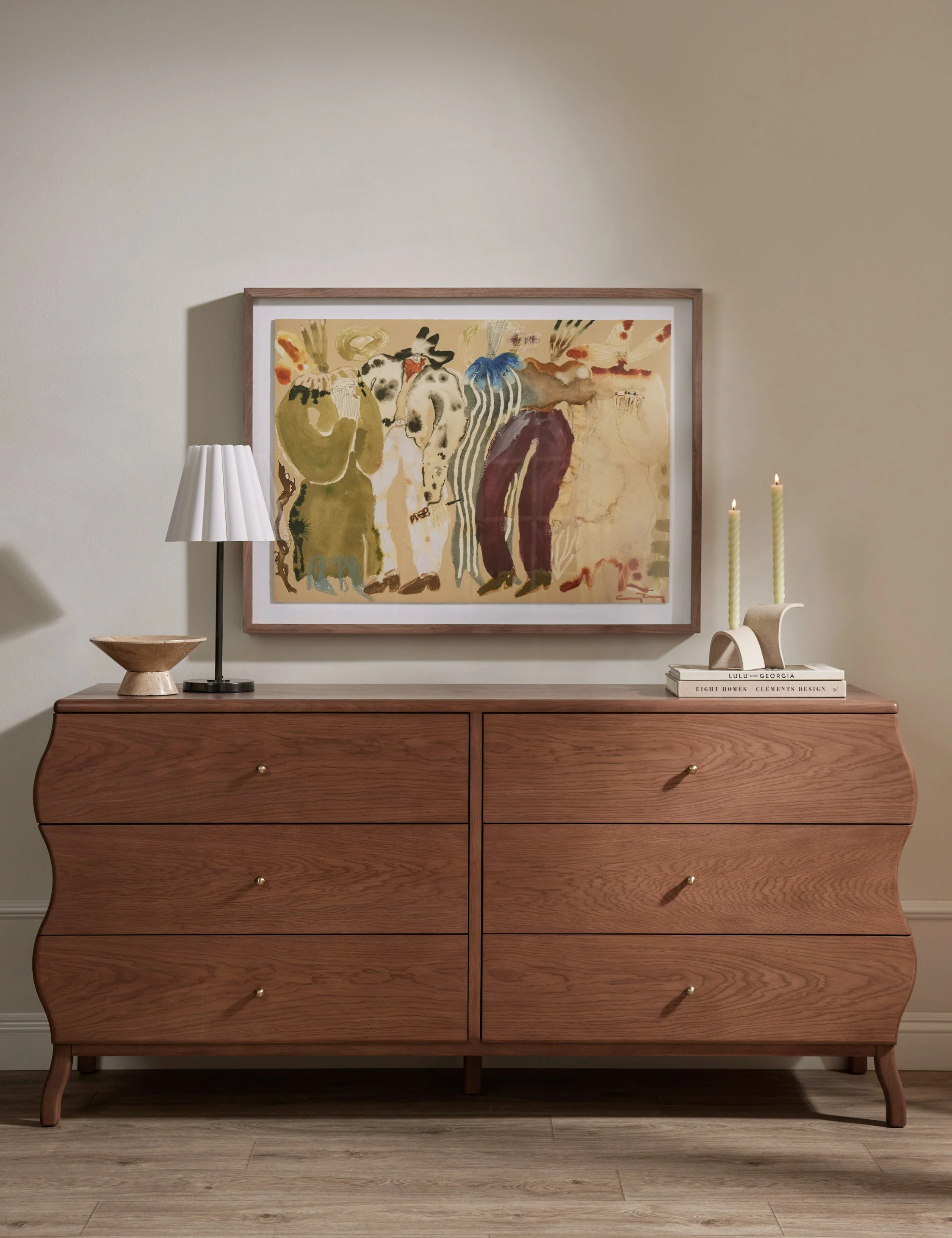 Dresser The dresser brings a whimsical line to spacious bedroom storage. The wavy silhouette strikes a modern feel, with brass ball drawer pulls