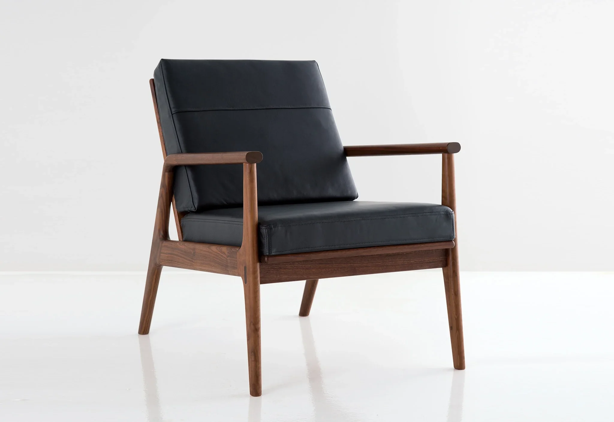 Chair - The celebrates contemporary design, the natural beauty of wood, and traditional joinery techniques that are a