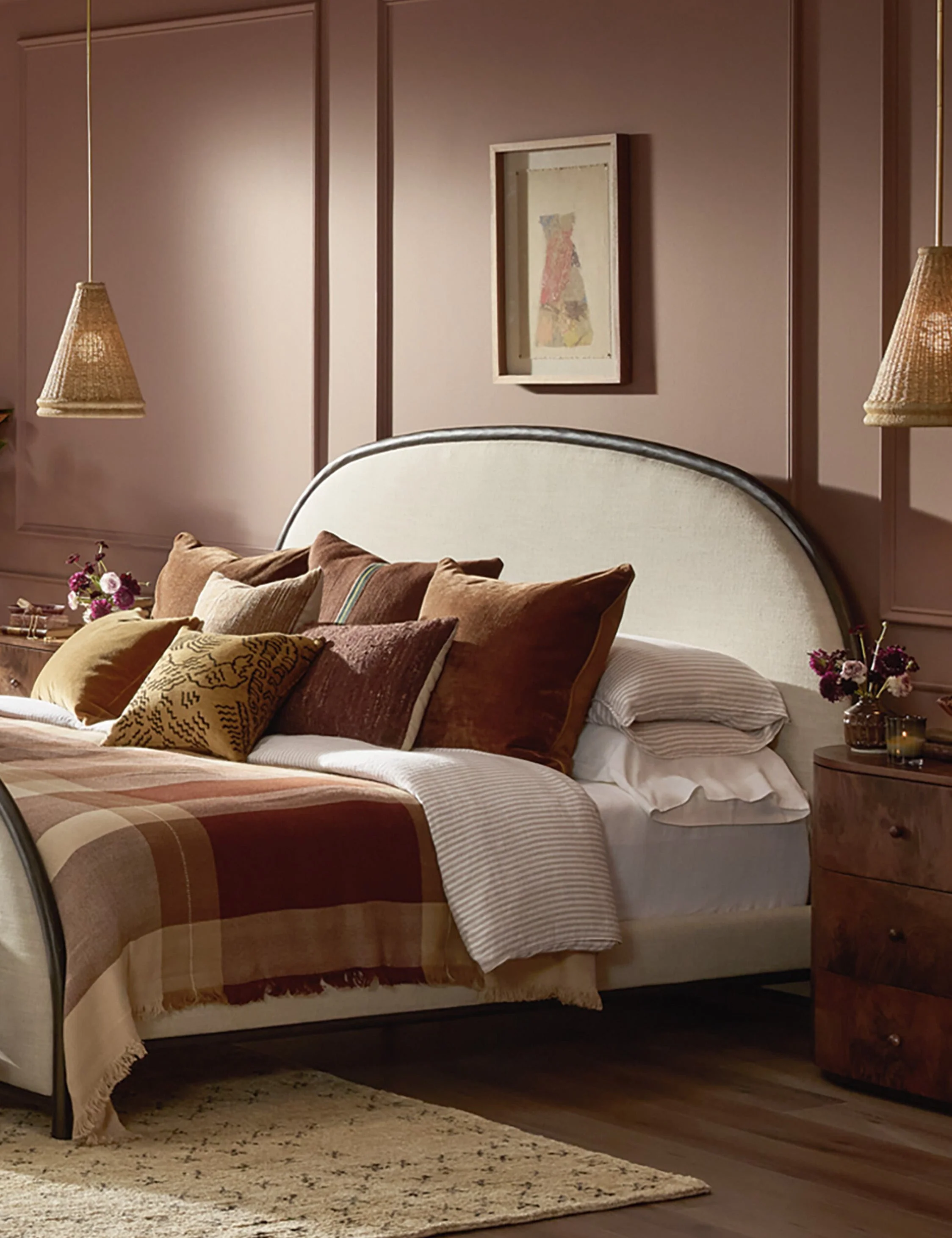 Platform Bed - Architectural curves define the bed, featuring a sculpted half-crescent headboard and footboard framed in dark metal