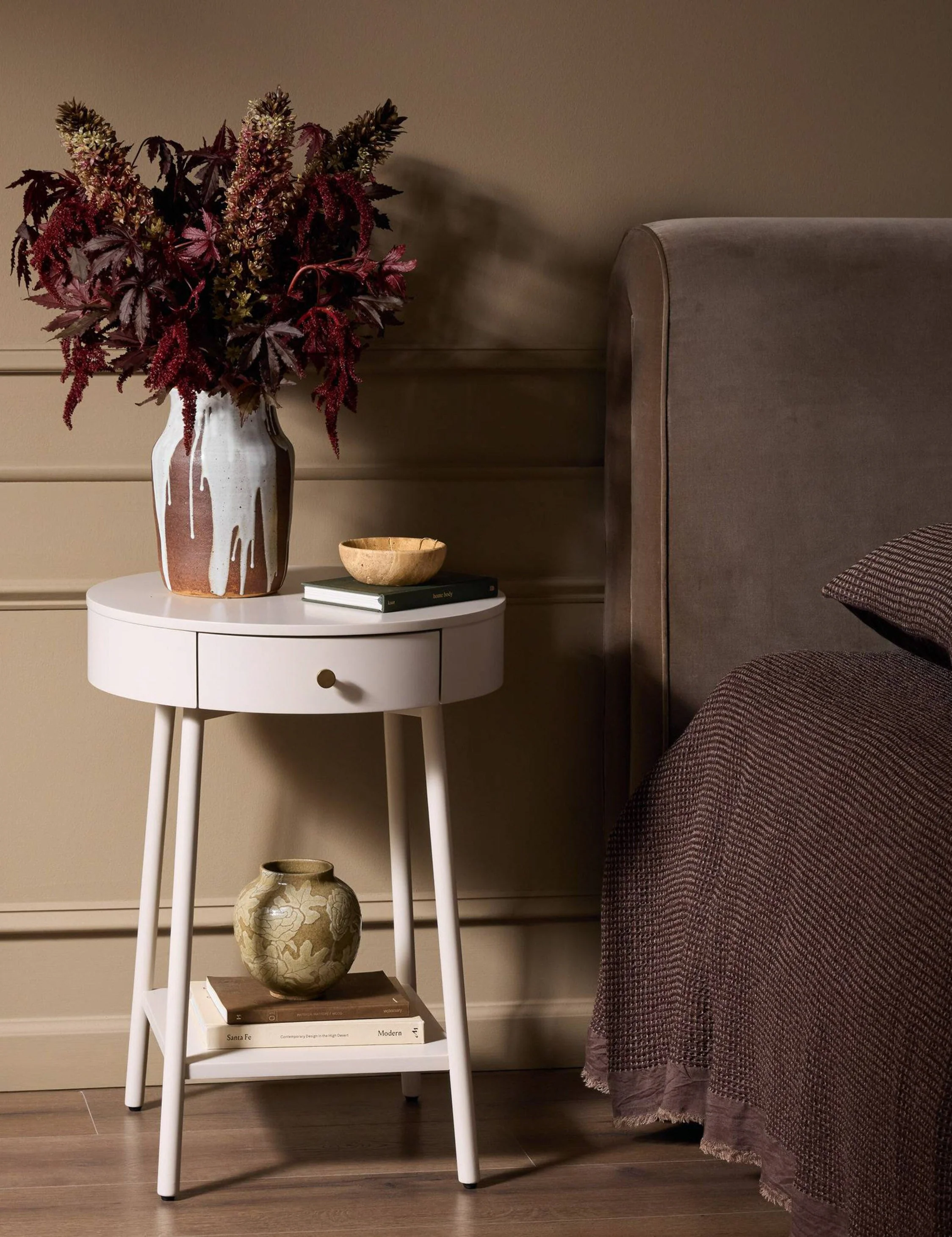 Nightstand An elegantly curved design, timeless off-white finish, and petite scale make this nightstand a chic and timeless accent piece. Featuring