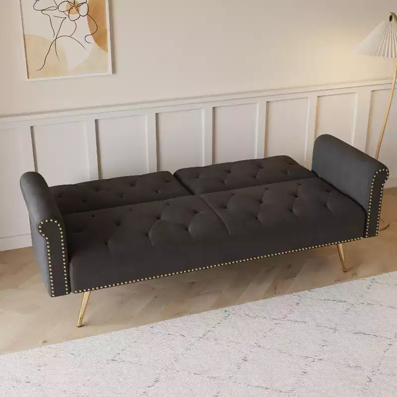 Black Velvet Fabric Sofa Featuring Nail Head Trim and Accompanied By A Matching Throw Pillow