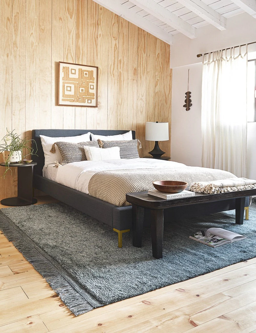 Bed Pared-down to its essential lines, this platform bed is a study in refined design. The crisp, simple corners of its frame and headboard invite