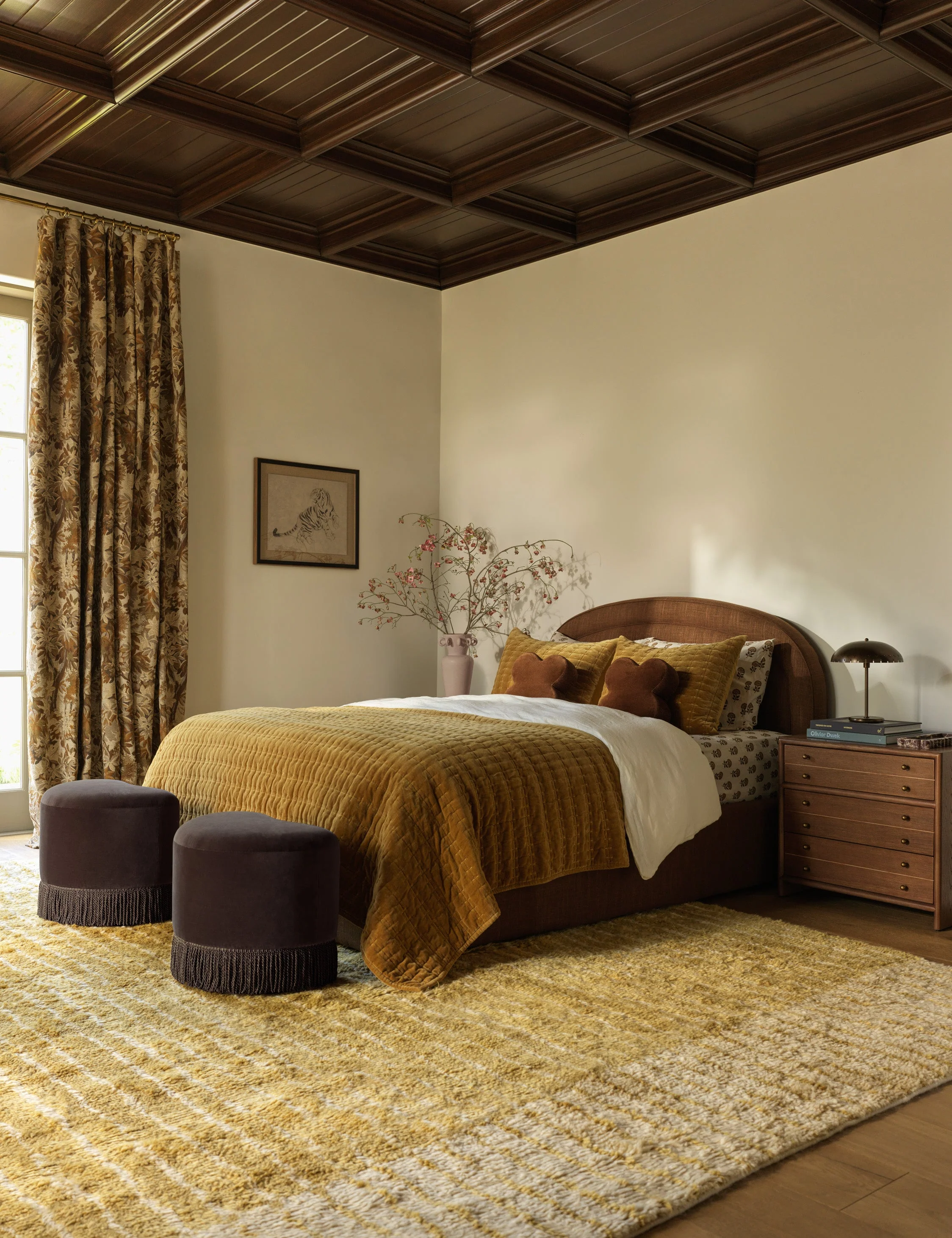 Bed The bed offers a transitional look that's set for timeless comfort. Its arched headboard styles a soft, sly silhouette highlighted by